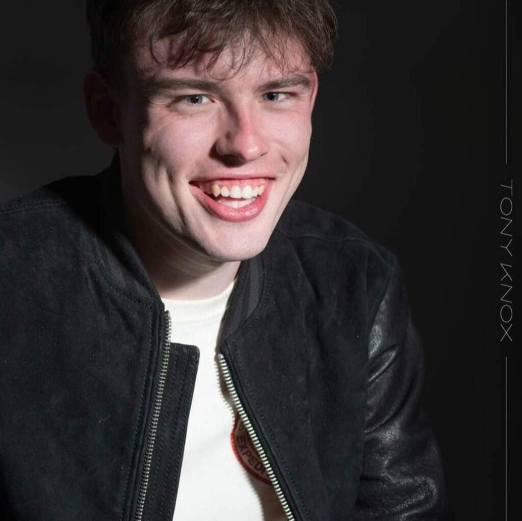Charlie Crothers smiling in a headshot